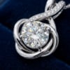 Extreme macro photography of 1.5ct brilliant round cut moissanite diamond 58 facet rainbow fire dispersion and white gold setting